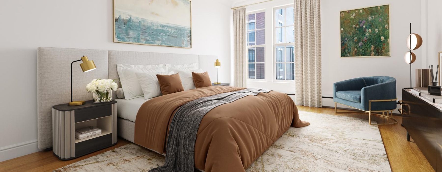 A cozy bedroom featuring a cream-colored bed with a brown blanket, a large window allowing natural light to fill the room, and a comfortable couch.